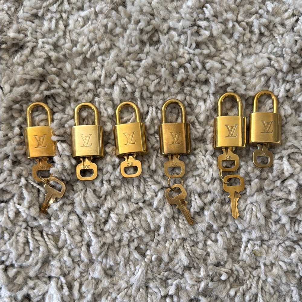 $120 for all Louis Vuitton 6 Gold Padlocks